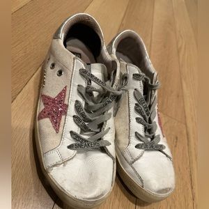 Golden goose superstar sneakers.